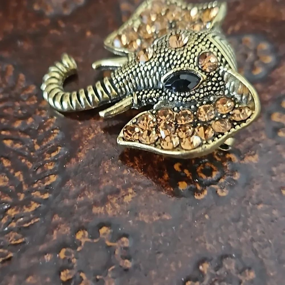 NWOT Gold tone crystal elephant brooch.